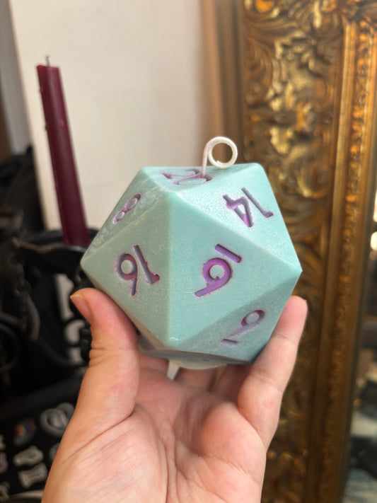 D20 candle with surprise die inside