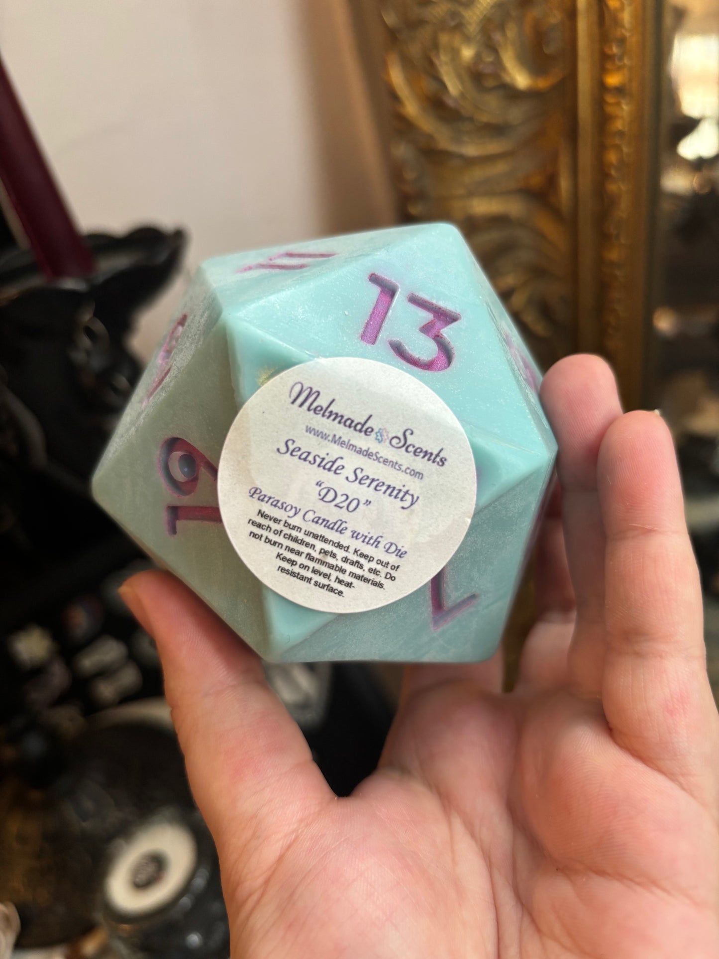 D20 candle with surprise die inside