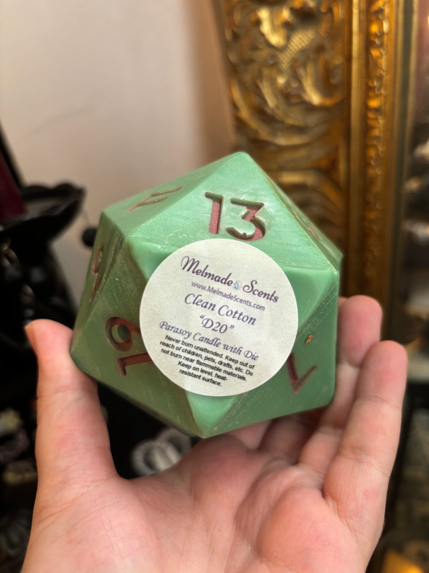 D20 candle with surprise die inside