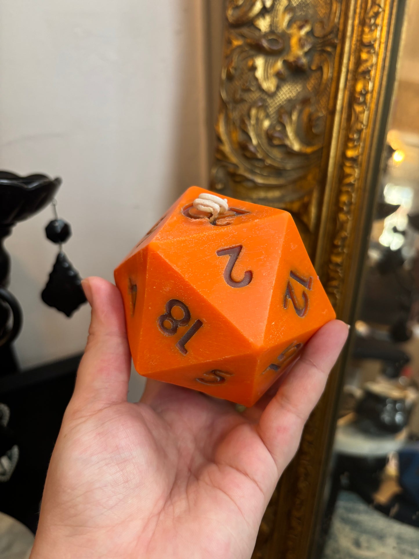 D20 candle with surprise die inside