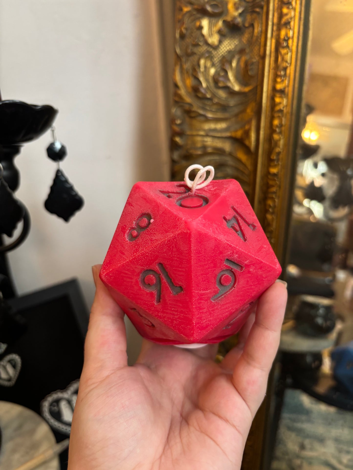 D20 candle with surprise die inside