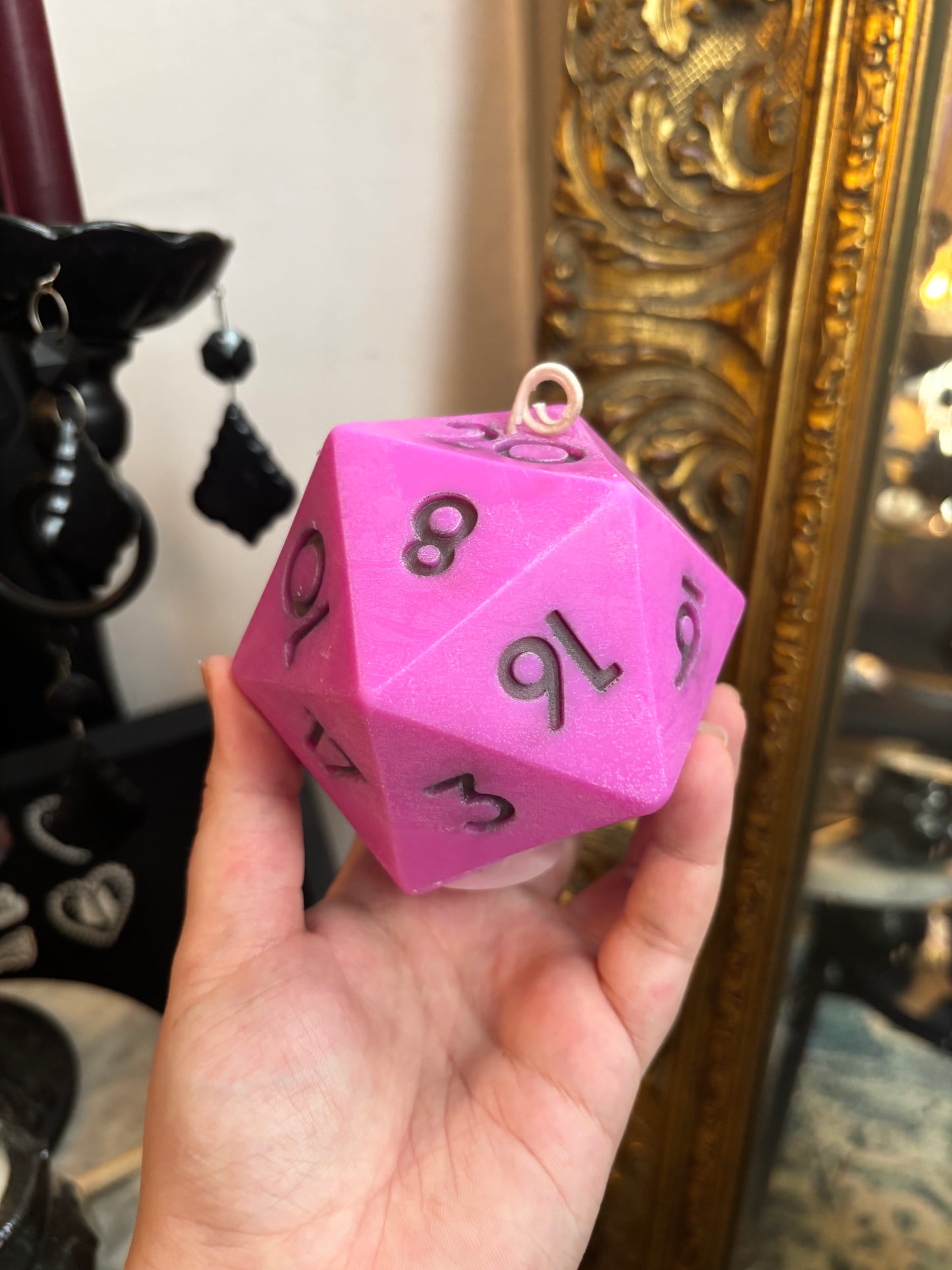 D20 candle with surprise die inside