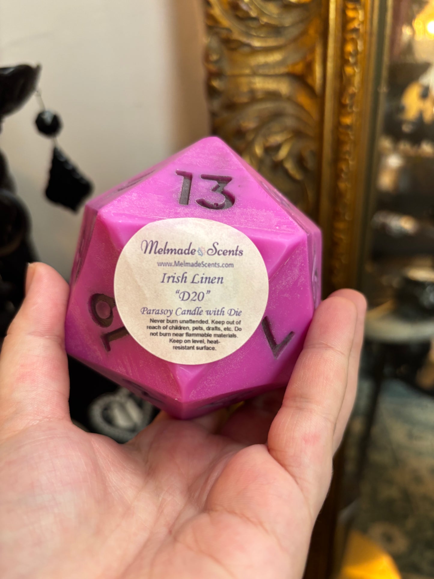 D20 candle with surprise die inside