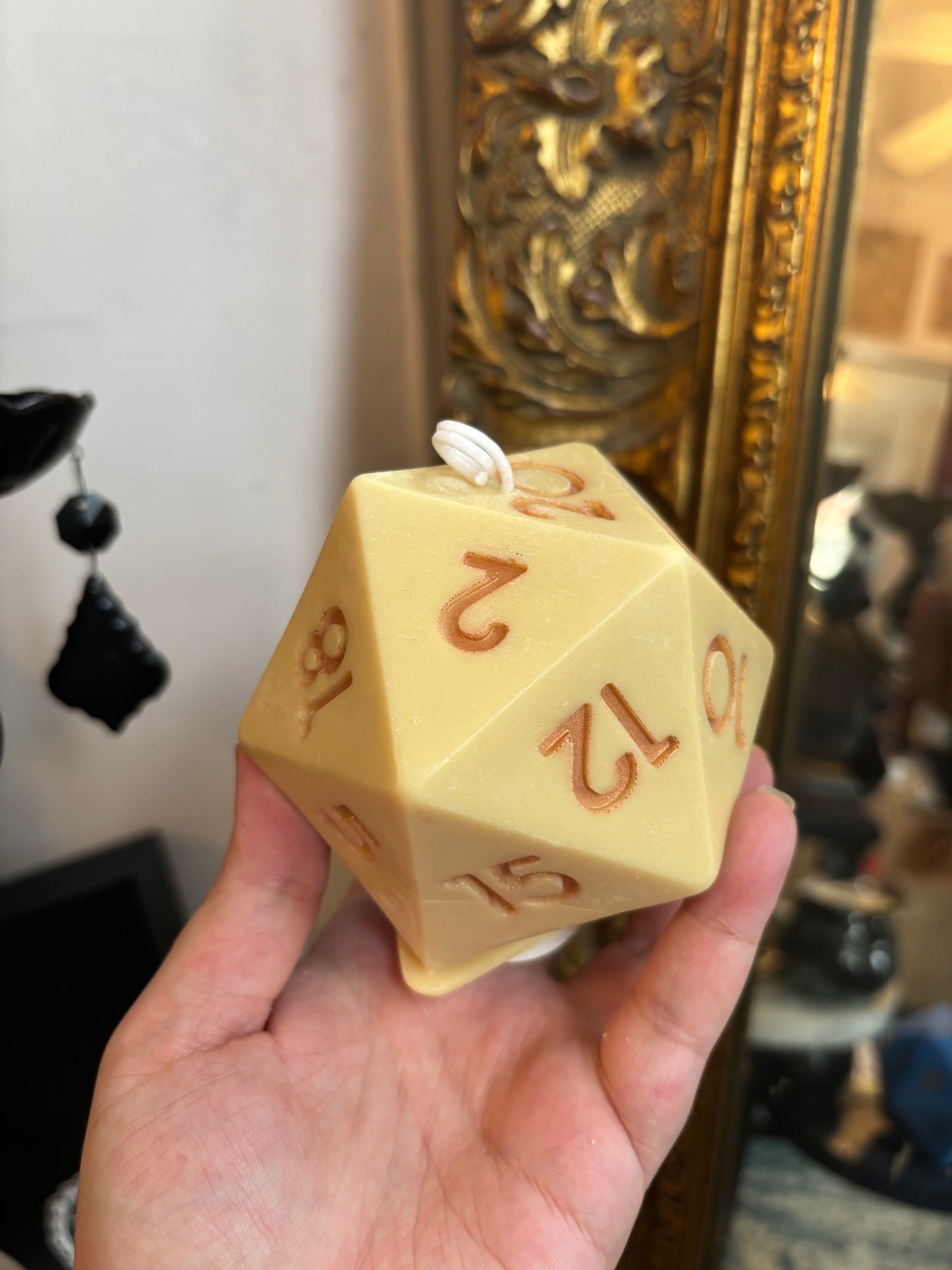 D20 candle with surprise die inside