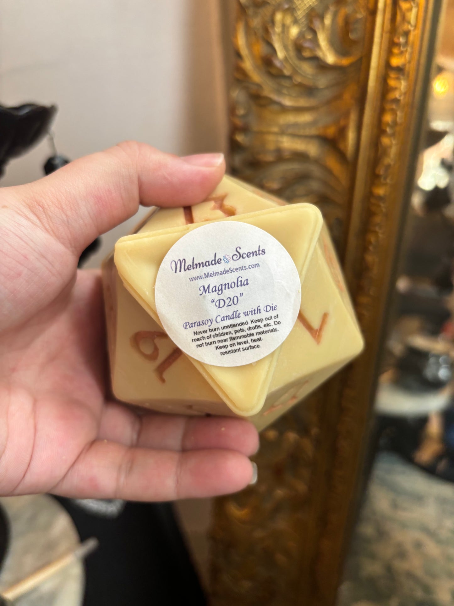 D20 candle with surprise die inside